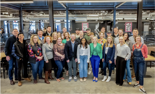 A group of participants stand together at the Instigator Summit in Fargo, North Dakota.