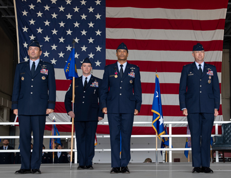 From left, U.S. Air Force Lt. Gen. Kevin Kennedy, 16th Air Force commander, Chief Master Sgt. Carl Vogel, outgoing 319th Reconnaissance Wing commander, Col. Timothy Curry, and Col. Timothy Monroe, 319th Reconnaissance Wing commander stand during a change of command ceremony June 23, 2023 on Grand Forks Air Force Base, North Dakota. A change of command is a military tradition that represents a formal transfer of authority and responsibility for a unit from one commanding or flag officer to another.