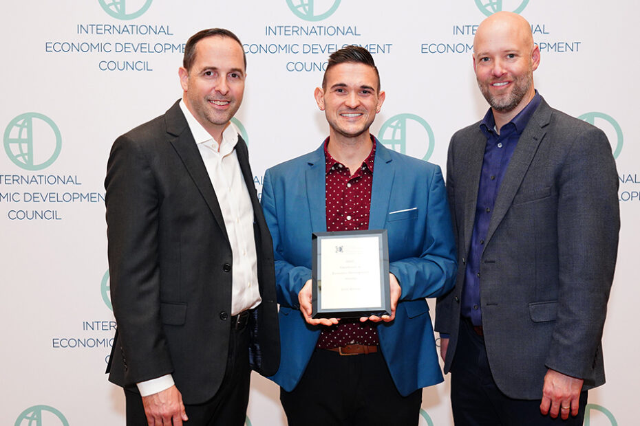 IEDC leadership present the Gold Award to the Grand Forks Region EDC at the annual conference in Dallas, TX. From left to right, IEDC President & CEO, Nathan Ohle, Grand Forks Region EDC Marketing & Communications Manager, Mark Maliskey, and IEDC Chair, Jonas Peterson.