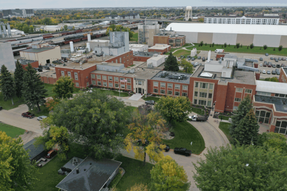 A bird's eye view of the building and main entrance of the UND EERC in Grand Forks, North Dakota. Expanding beyond that is Grand Forks and the UND Campus.