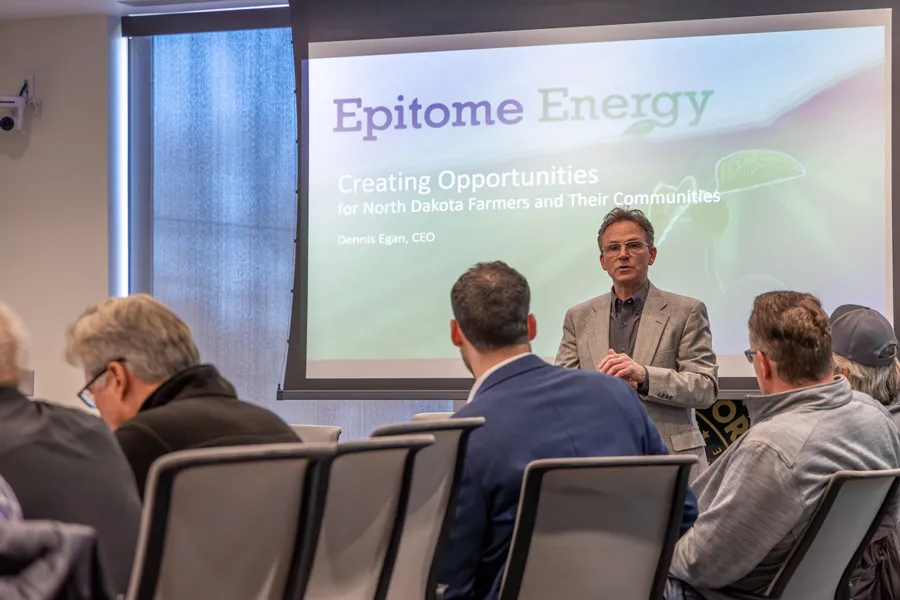 Dennis Egan stands in front of a projected presentation that reads Epitome Energy at The HIVE.