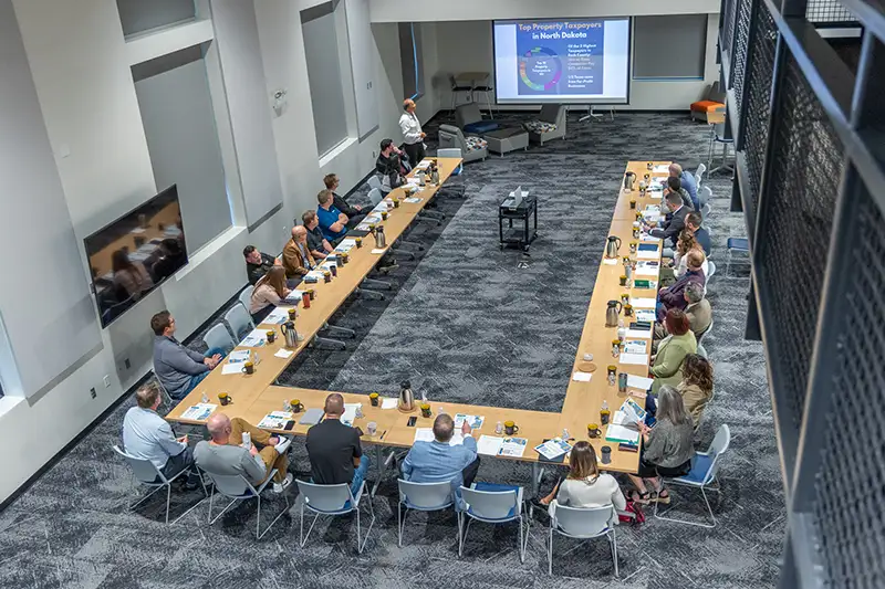 A bird's eye view of the horseshoe shaped table of EDC Advisory Board members as Chamber President & CEO Barry WIlfahrt presents.