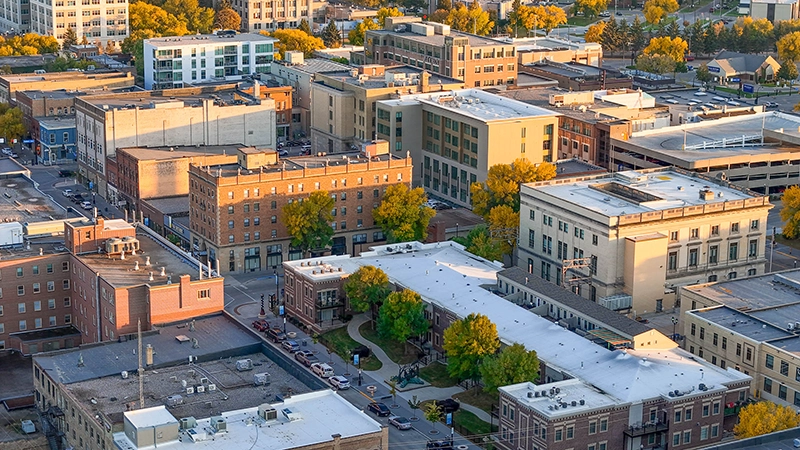 A drone shot of the buildings in Downtown Grand Forks.