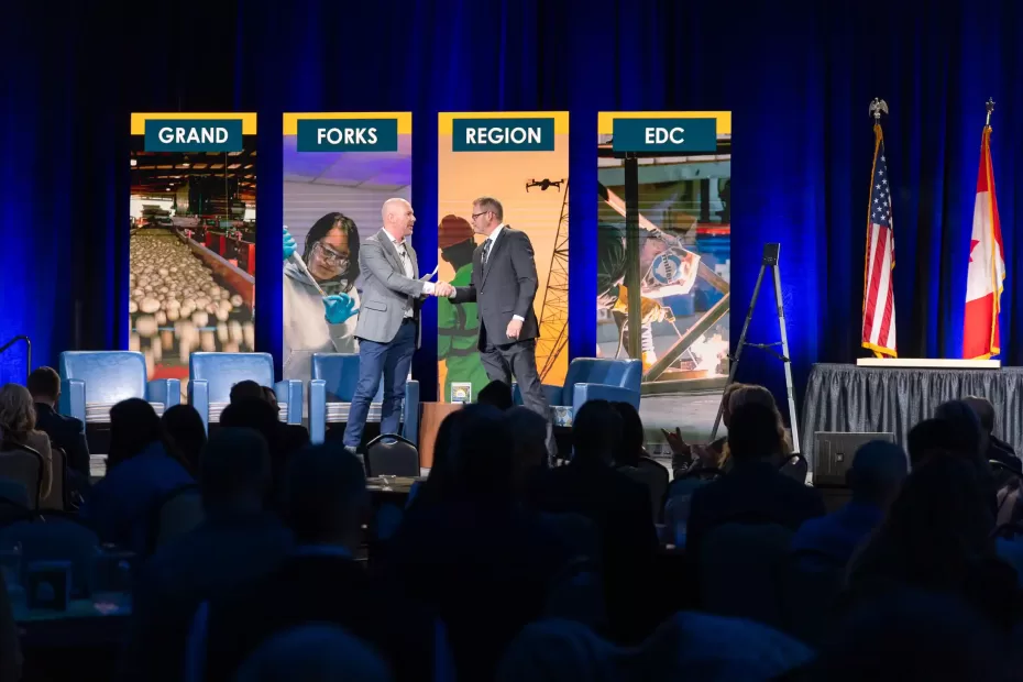 EDC Board Chair Shawn Gaddie and President & CEO Keith Lund shake hands closing the meeting.