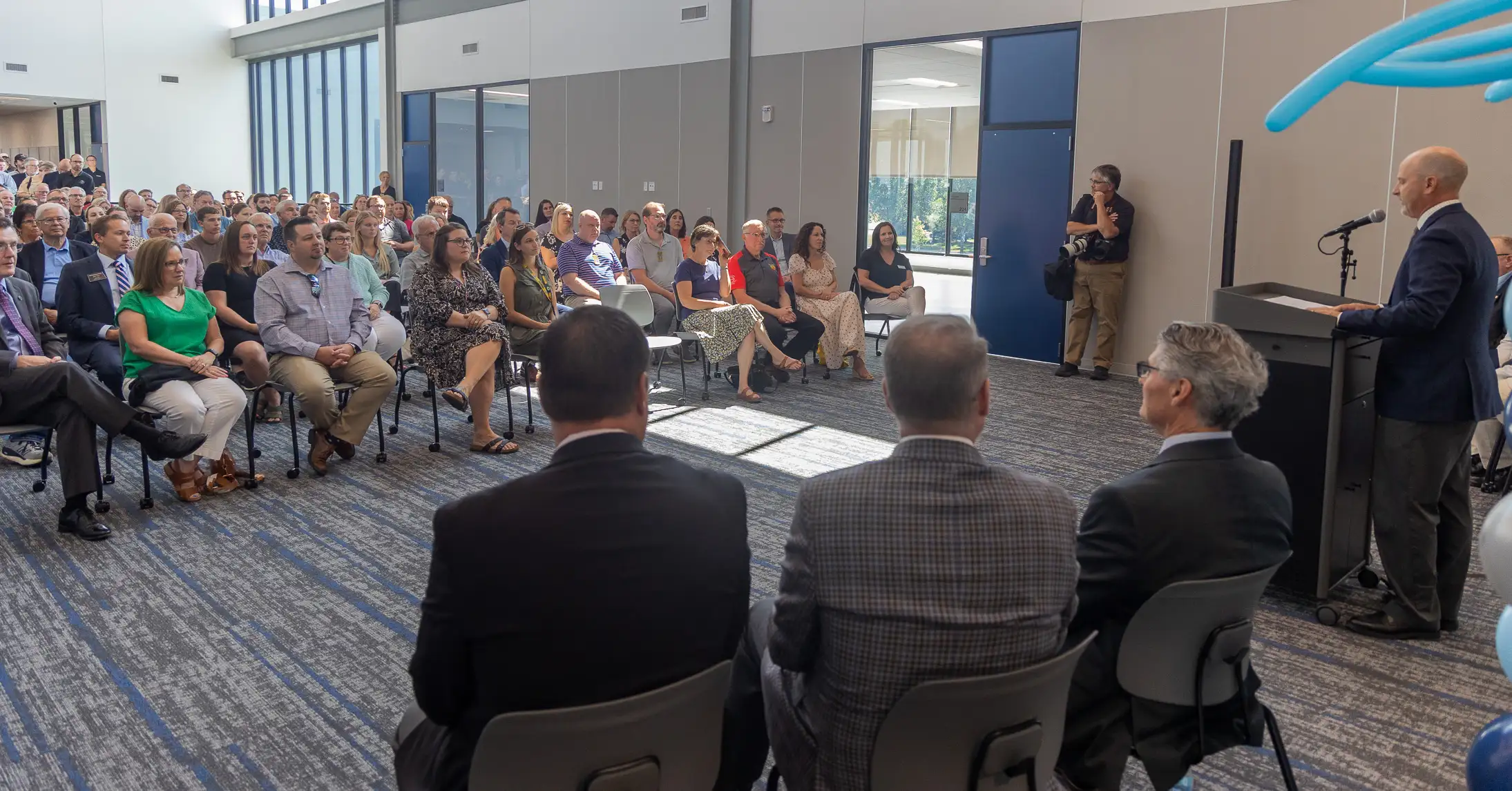 The crowd of people gathered in seats for the Career Impact Academy ribbon-cutting.