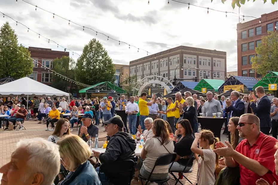 A crowd gathers in Grand Forks town square listening to speakers at the Agristo Community Welcome event on Monday, August 25th.
