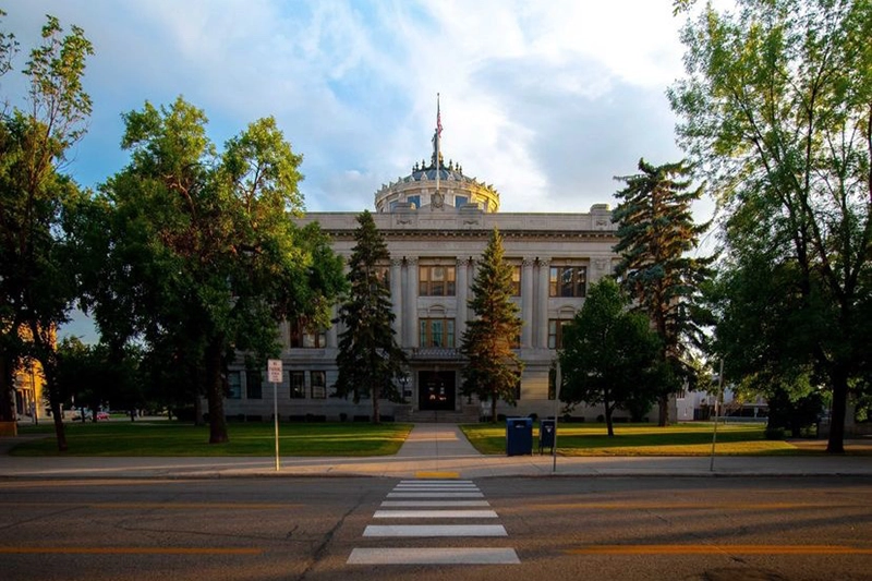 A building in Grand Forks with a crosswalk leading up to it.