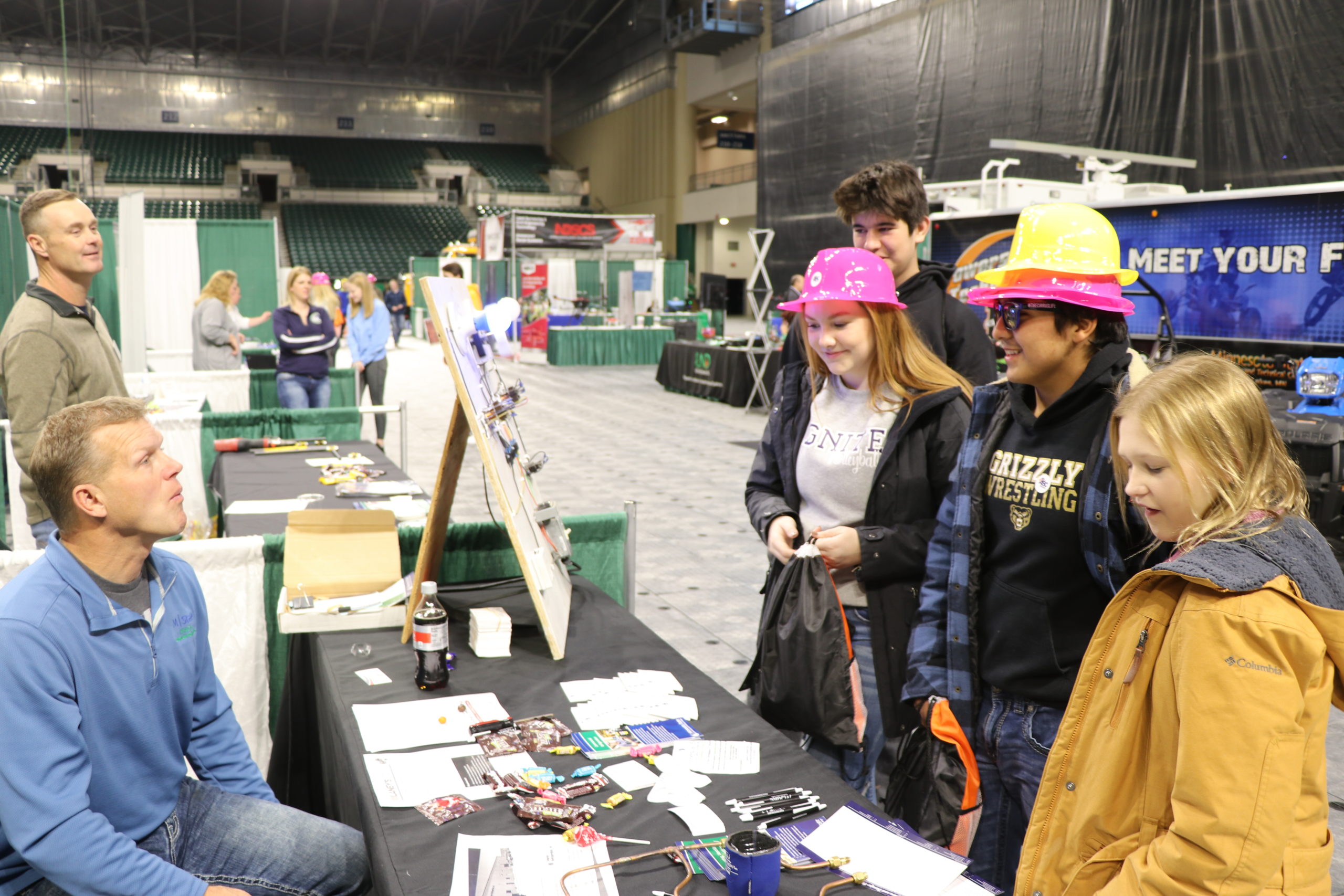 Students visit a booth at Northern Valley Careers in Grand Forks