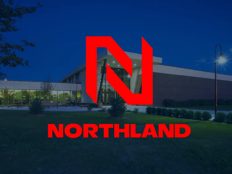 The entrance of the Northland Community and Technical College entrance in East Grand Forks with the Northland logo lockup.