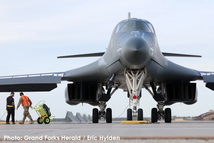 A b1-b bomber is refueled at the runway at Grand Forks Air Force Base.