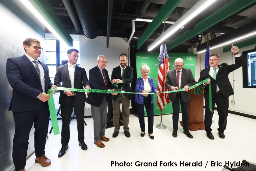 (L-R) Brian Tande, dean, College of Engineering and Mines; Mayor Brandon Bochenski; Mark Thompson; Ryan Adams, associate dean of national security; Claudia Thompson; state Rep. Mark Sanford and UND President Andrew Armacost cut a ribbon at the grand opening ceremony of the Mark and Claudia Thompson National Security Corridor at UND Monday, Oct. 7, 2024