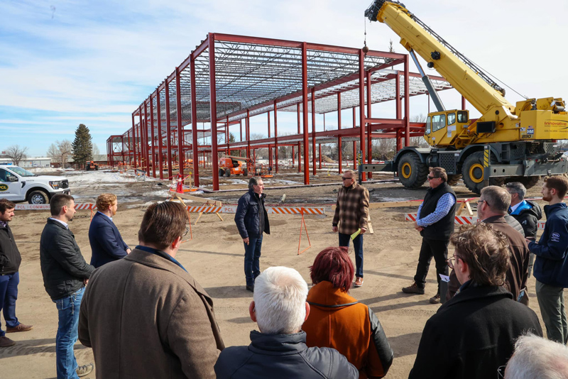 Governor Burgum stands at the career impact academy construction site.