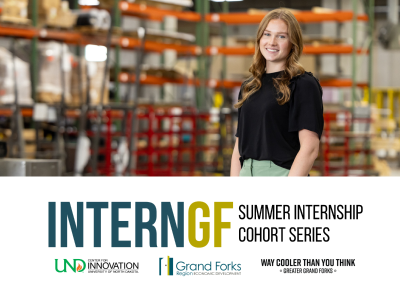 A female intern is posed in a warehouse with the InternGF logo, UND Center for Innovation, Grand Forks Region EDC, and Way Cooler Than You Think logo, and the title Summer Internship Cohort Series.