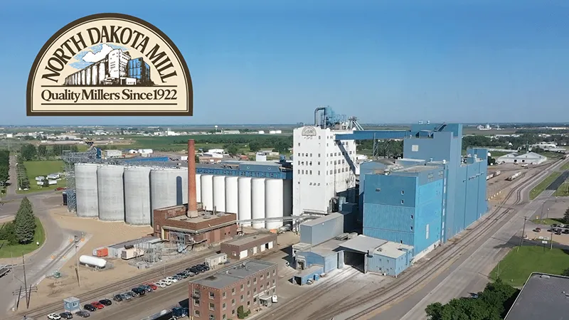 A drone image of the North Dakota mill facility in Grand Forks with the ND Mill logo.